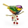A bird sitting on a branch - crystal broochBrooches
