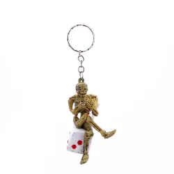 Skeleton sitting on a dice - keychainKeyrings
