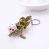 Skeleton sitting on a dice - keychainKeyrings